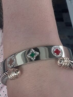 This is a stainless steel, silver-toned bangle bracelet